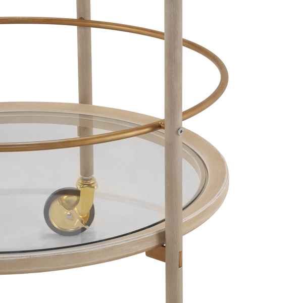 Close-up of a round glass-topped table with metal legs and wheels on a white background