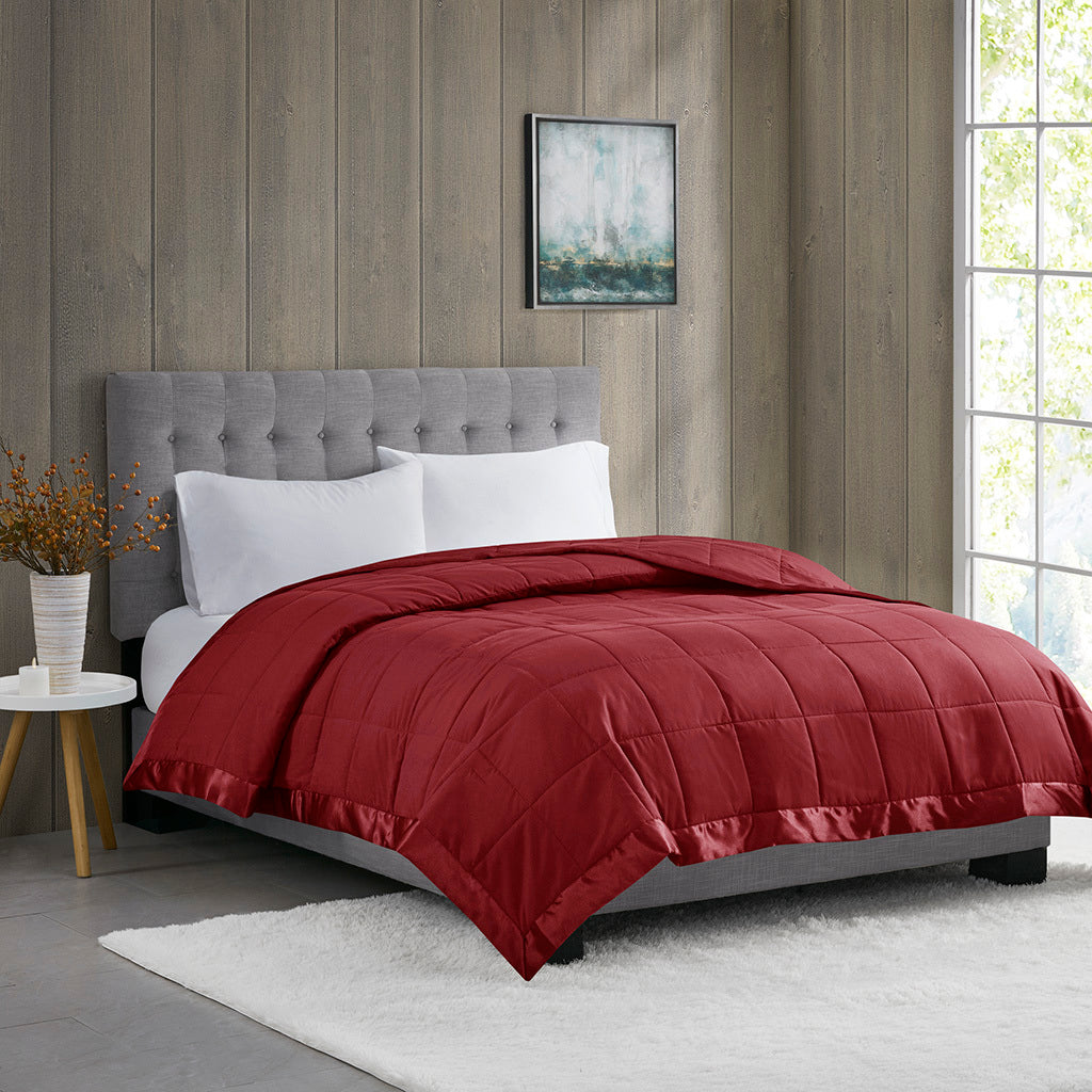 Down Alternative Blanket Burgundy Twin - Budget Comfort displayed on a modern bed with tufted headboard in a cozy bedroom setting.