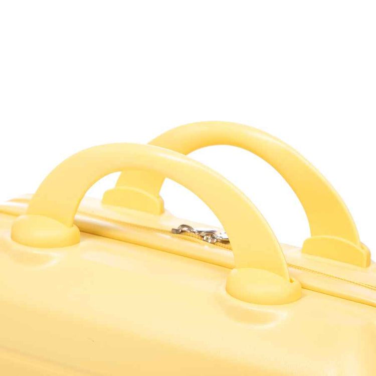 Close-up of yellow ABS spinner luggage handle with sturdy curved design and smooth finish, ideal for travel convenience.