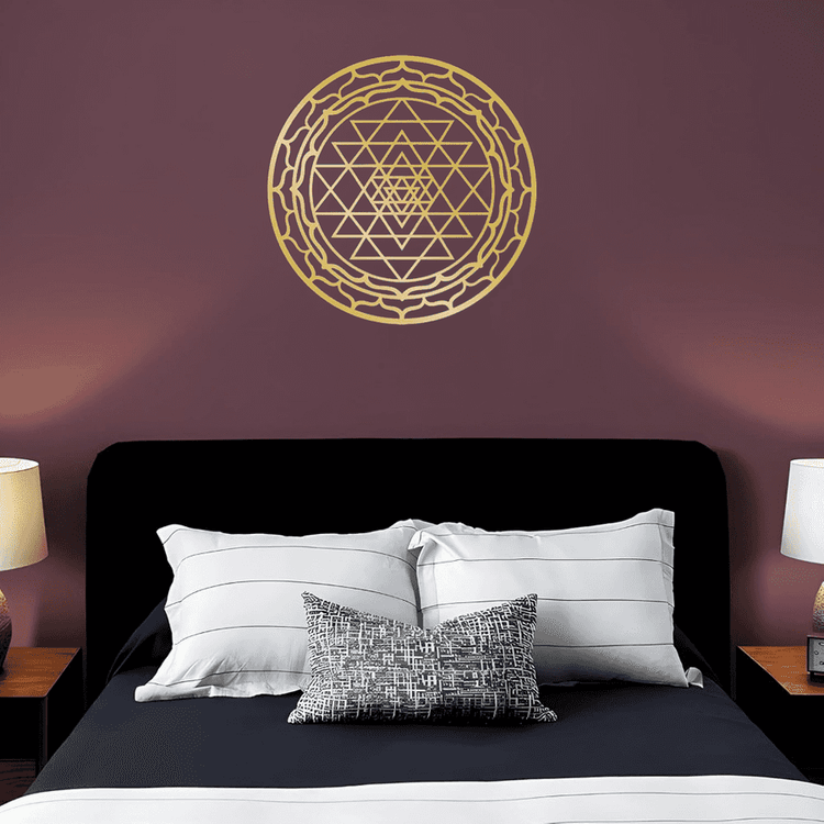 Sacred Mandala Aluminum Wall Art by CIFbuy mounted above a bed with striped pillows. Enhances bedroom decor with spiritual elegance.