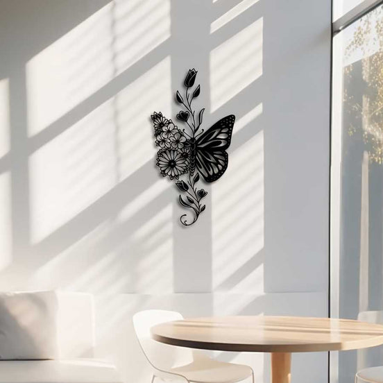 Rustic aluminum butterfly wall art casting shadows on a sunlit white wall, perfect for modern farmhouse interiors.