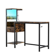 Angled view of office computer desk with LED lighting and power outlet, featuring rustic finish and modern design.