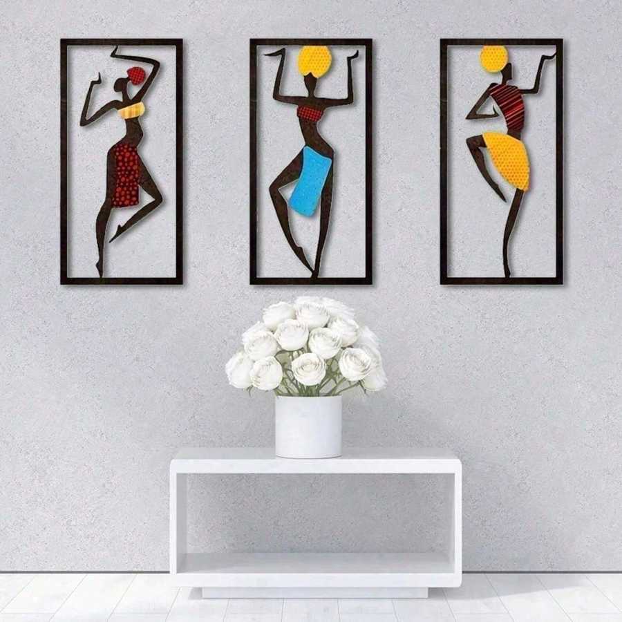 Bohemian Macrame Wall Hanging with African dancer artwork on a gray wall above a white console with white roses. Elegant handmade wall art.