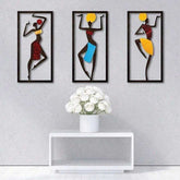 Bohemian Macrame Wall Hanging with African dancer artwork on a gray wall above a white console with white roses. Elegant handmade wall art.