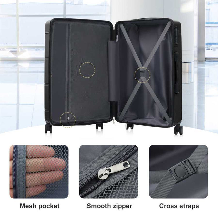 Black suitcase with open lid showing mesh pocket, smooth zipper, and cross straps in a bright indoor setting.