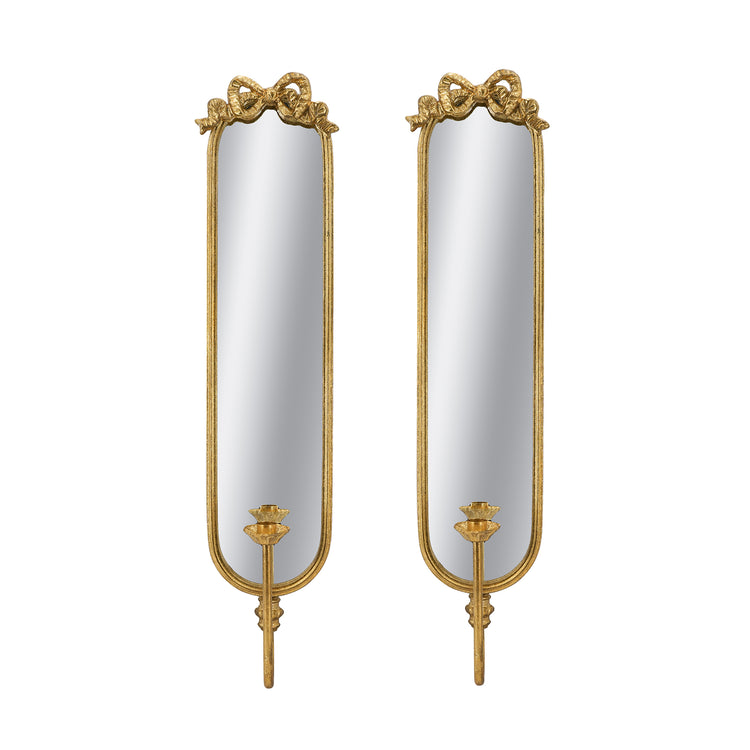 A pair of tall, narrow wall mirrors with ornate gold frames, bow details at the top, and candle-style holders at the bottom, shown on a plain white background.
