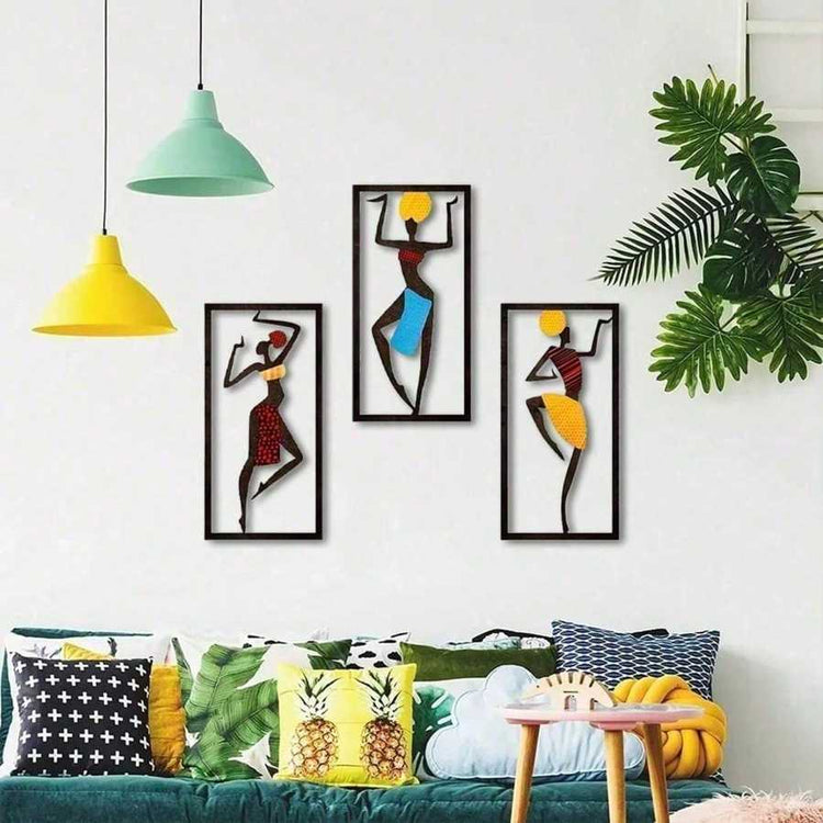 Bohemian Macrame Wall Hanging with African dancer silhouettes in a colorful living room with tropical cushions and pendant lights. Artistic wall decor.