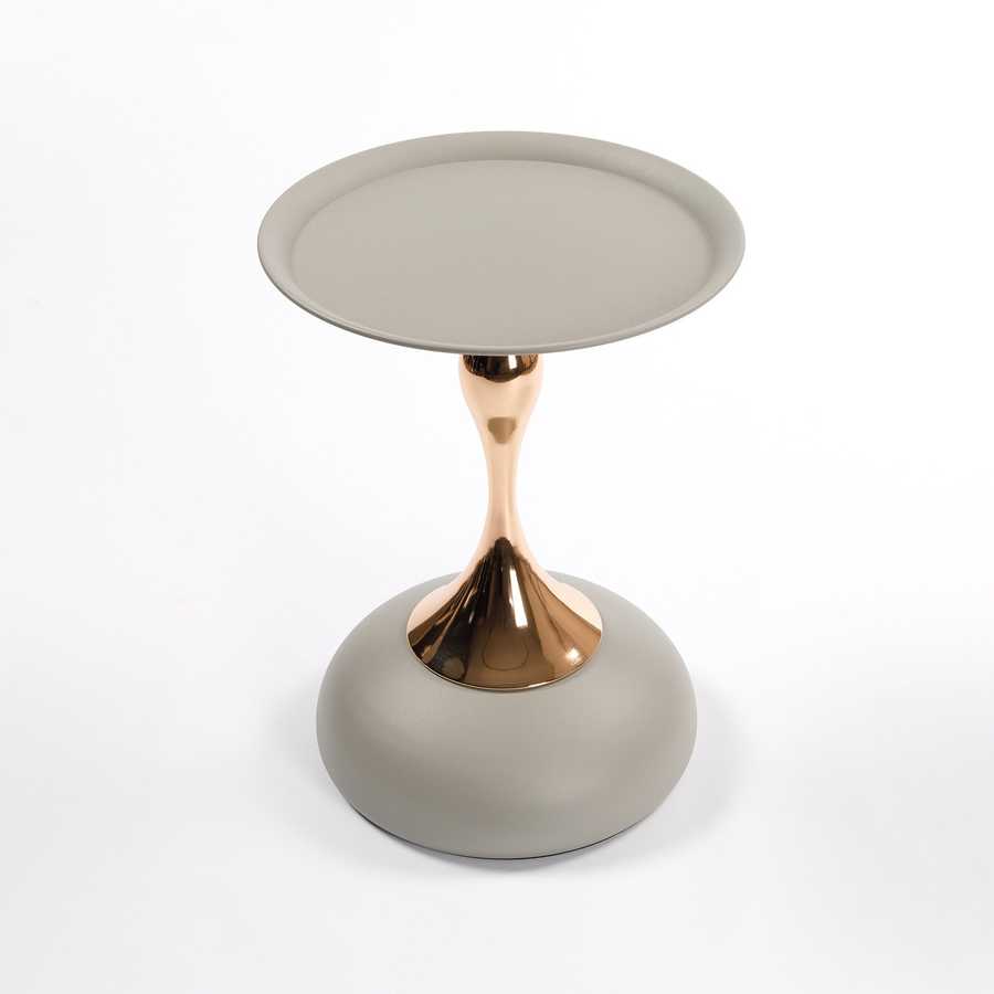 Angled top view of the Mermaid Tail Coffee Table showing its compact, stylish form with a round grey surface and gold accent.