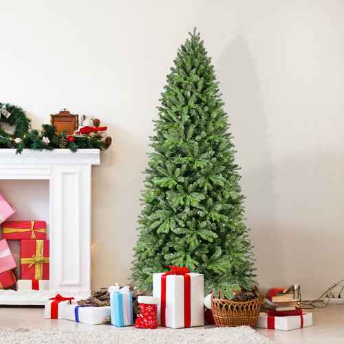 4 ft green Christmas tree with gifts beside a fireplace