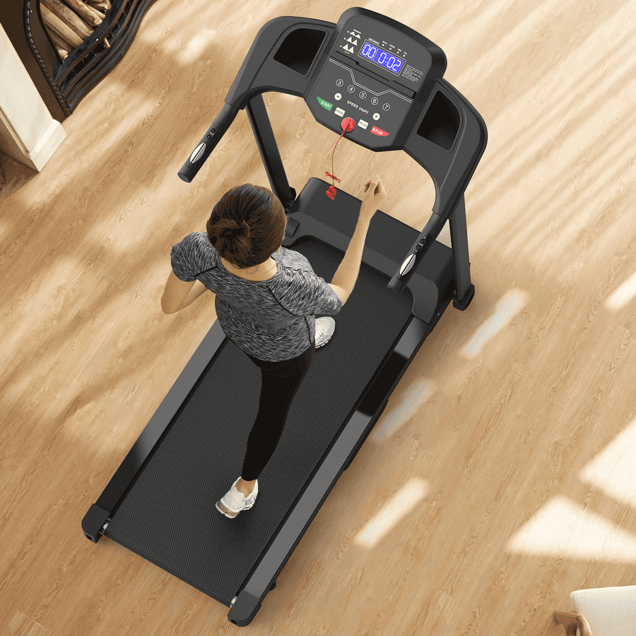 Woman walking on treadmill in home setting