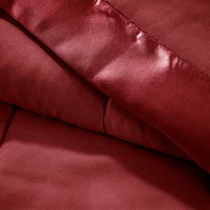 Close-up of Down Alternative Blanket Burgundy Twin - Budget Comfort showing soft texture and satin trim for a luxurious feel.