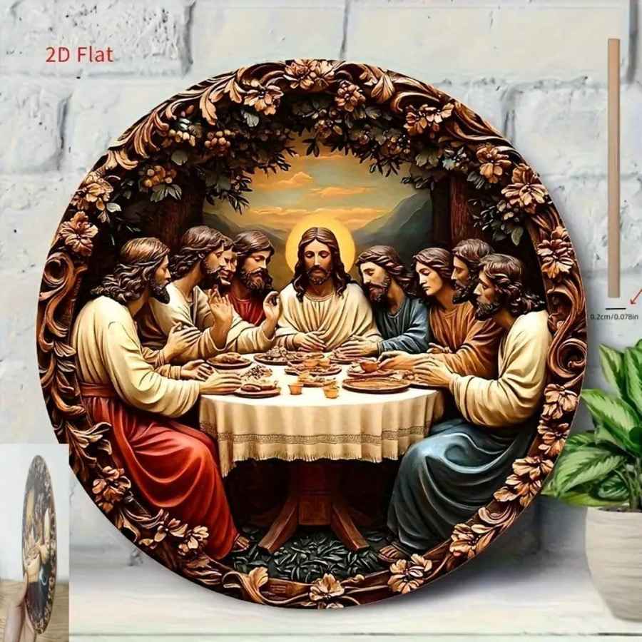 A large round decorative wall plaque depicting the Last Supper, styled as a 3D relief sculpture with an ornate carved wooden frame. The plaque is shown leaning against a white brick wall next to a potted plant.