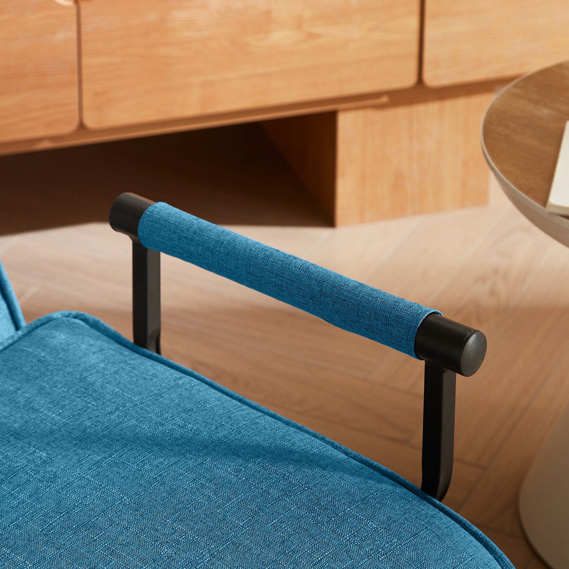 Close-up of the padded armrest on the Convertible Folding Chair Bed - Compact & Multi-Functional, highlighting comfort and design details.