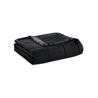 Folded black Lightweight Down Alternative Blanket with satin trim, showcasing compact storage and premium bedding material.