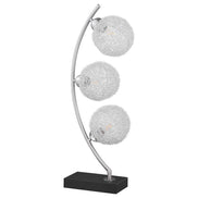Elegant black metal table lamp with three textured globe shades and a modern arched design, perfect for home or office lighting
