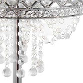 Silver-toned metal chandelier detail with clear faceted crystal drops and circular bead strands on a white background.