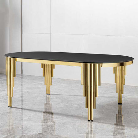 Elegant oval dining table with black tempered glass top and gold base, perfect for seating 8 in a contemporary dining space.