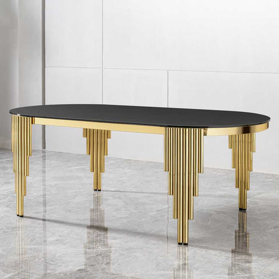 Elegant oval dining table with black tempered glass top and gold base, perfect for seating 8 in a contemporary dining space.
