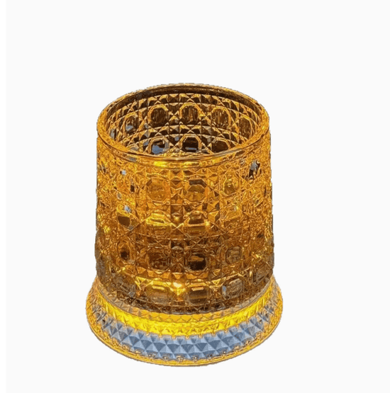 Decorative candle holder with intricate design on a white background