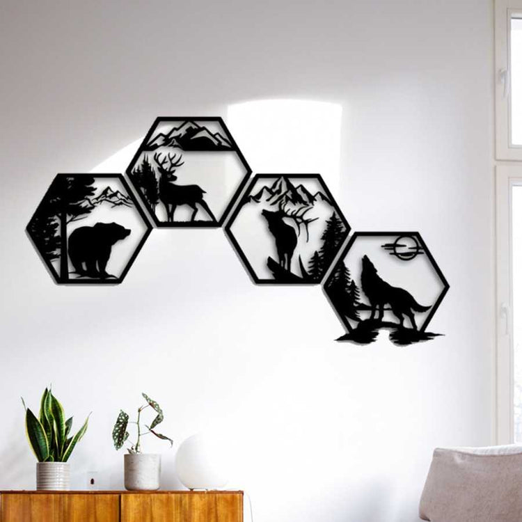 Iron Hexagon Wall Art Set on white wall with natural light, 4-piece black metal forest animal decor featuring bear, deer, elk, and wolf for rustic interiors.