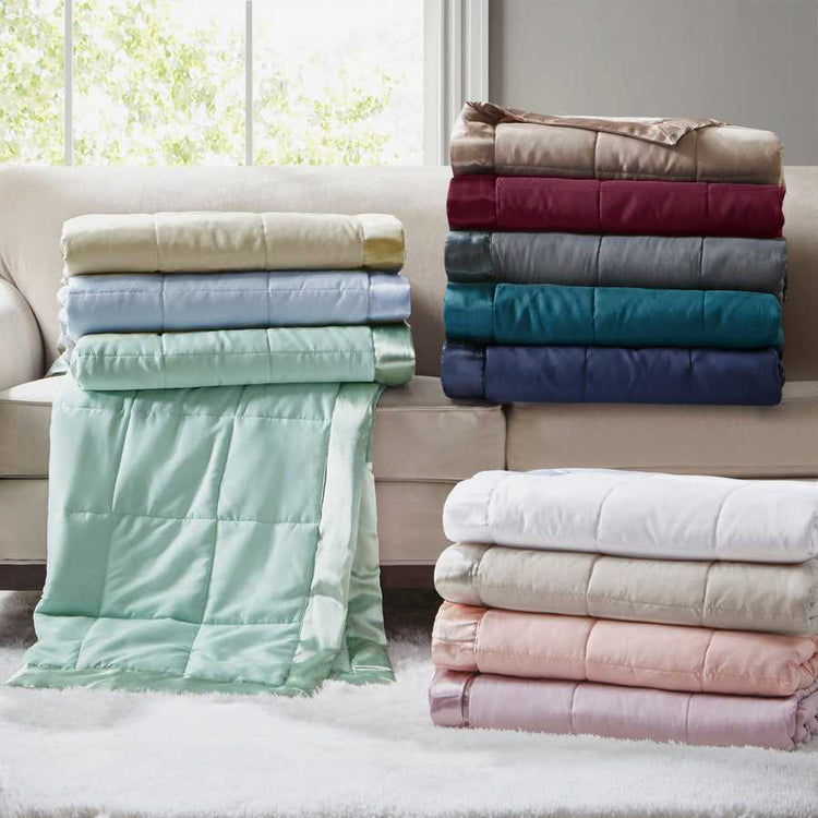 Assorted Down Alternative Blankets with satin trim in various colors, including teal twin, perfect for bedding variety and comfort.
