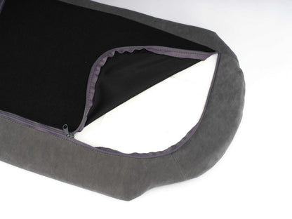 Close-up of the Scandinavian Elevated Dog Bed's zippered velvet cover revealing orthopedic foam insert for easy cleaning and pet support.