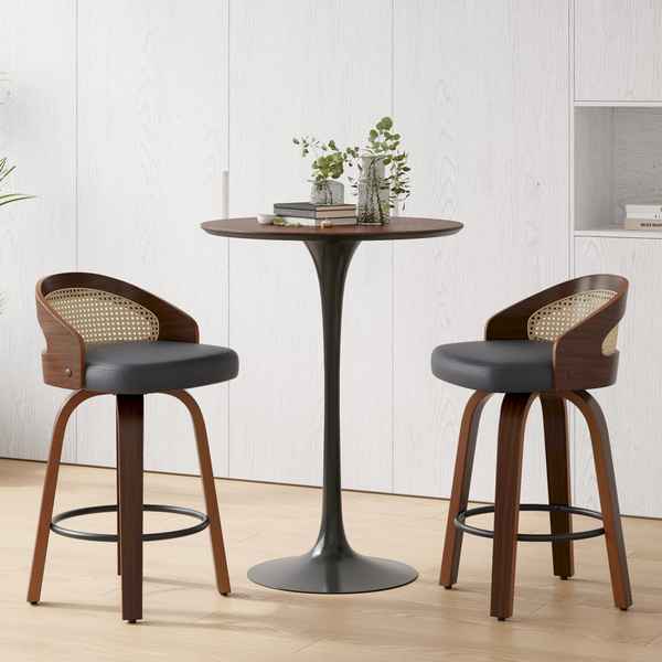Close-up of a modern bar stool with a black cushioned seat, curved wooden frame with cane backrest, and adjustable height, suitable for kitchen or bar area.
