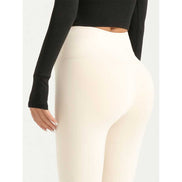 Back view of MLNshops MT20 Yoga Leggings in cream color, showing seamless high waist and smooth activewear fabric.