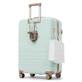 A mint green hardshell spinner suitcase with tan accents, shown on a white background with a water bottle in its side holder and a white shopping bag hanging from the side loop.