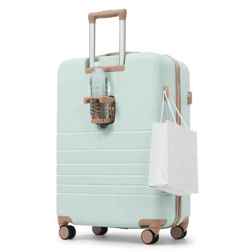 A mint green hardshell spinner suitcase with tan accents, shown on a white background with a water bottle in its side holder and a white shopping bag hanging from the side loop.