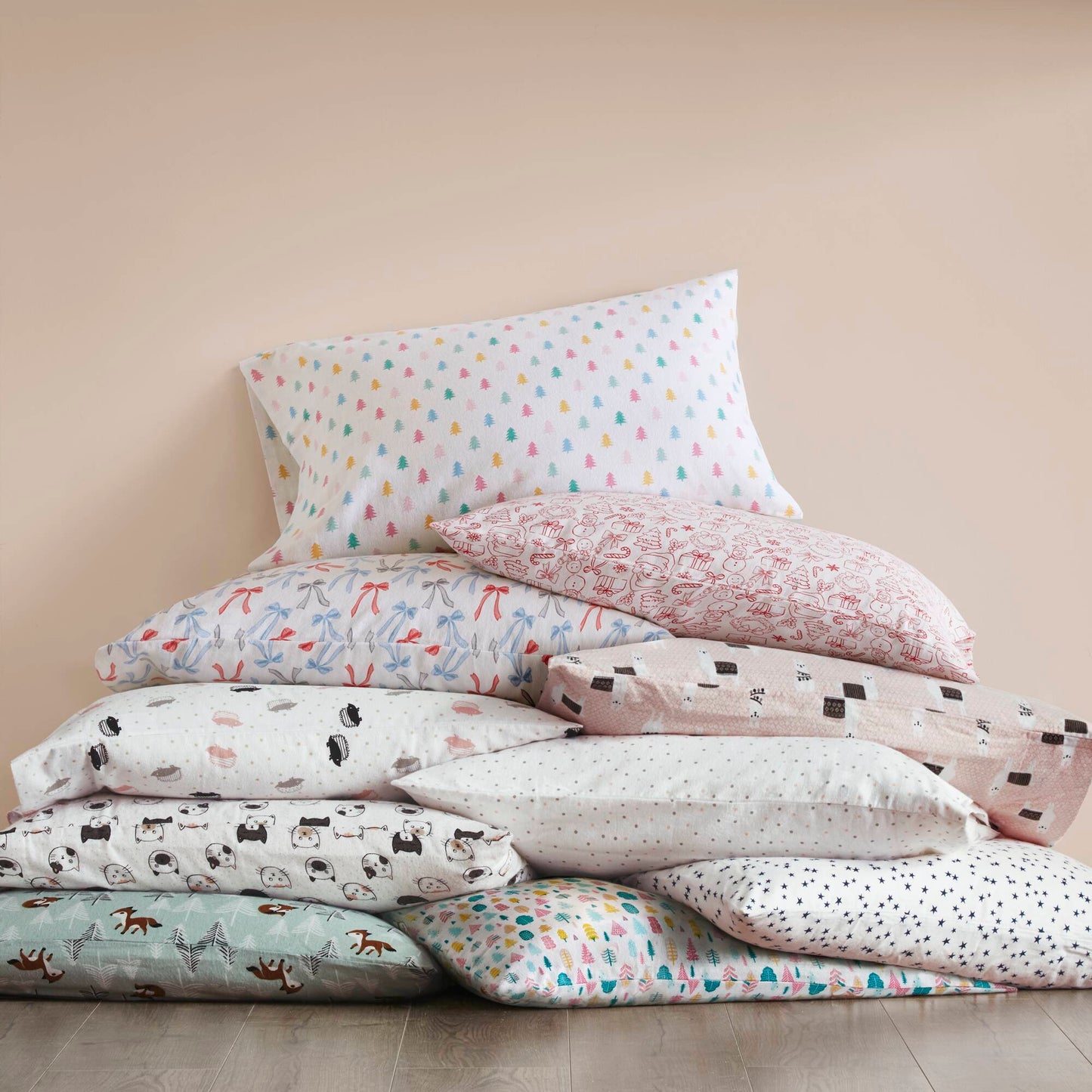 Holiday Doodles - Twin XL Cotton Flannel Sheet Set among a variety of colorful printed pillowcases, perfect for mixing and matching bedding styles.