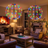 12 in and 16 in RGB LED ball lights hanging in a living room by a fireplace