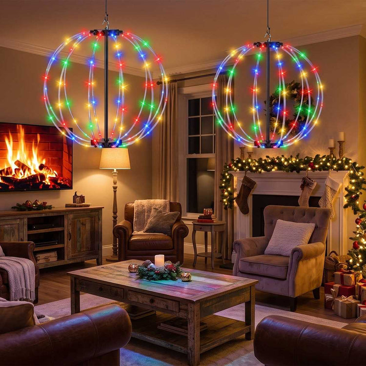 12 in and 16 in RGB LED ball lights hanging in a living room by a fireplace