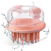 Pink scalp massager with clear top on a white background