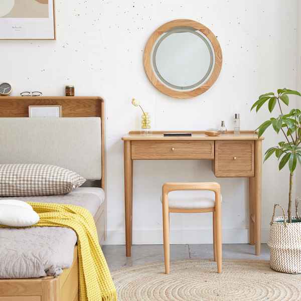 Wooden bedroom furniture set with bed, desk, and stool against a white wall.