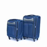 Close-up of blue suitcase with ergonomic handle extended, showing sturdy construction and smooth wheels for travel convenience.