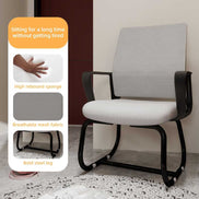 Gray office chair with black frame in a minimalistic room.