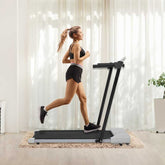 Woman running on treadmill in living room