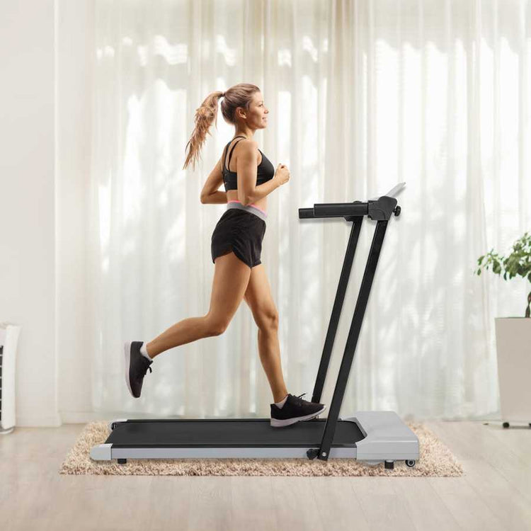 Woman running on treadmill in living room