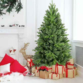 4 ft green Christmas tree with presents in a bright room
