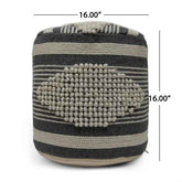 A cylindrical woven pouf or ottoman with a black and beige striped pattern and a raised beige textured center, shown on a white background with dimension lines indicating 16.00 inches in height and width.
