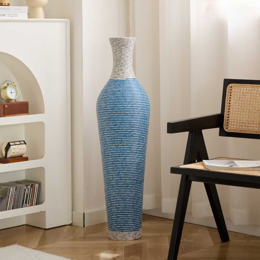Modern 39-inch floor vase decor in blue PVC placed beside a black chair, ideal for contemporary home and garden decor.