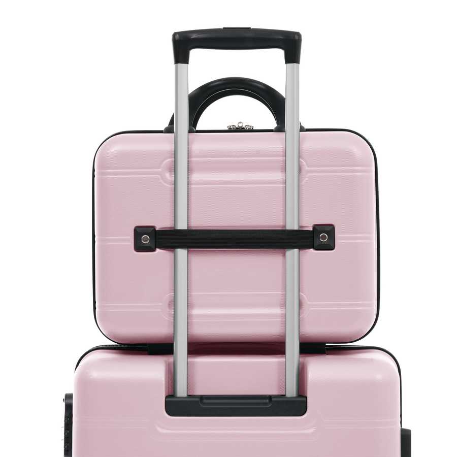 Pink suitcase with a black handle on a white background