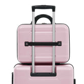 Pink suitcase with a black handle on a white background