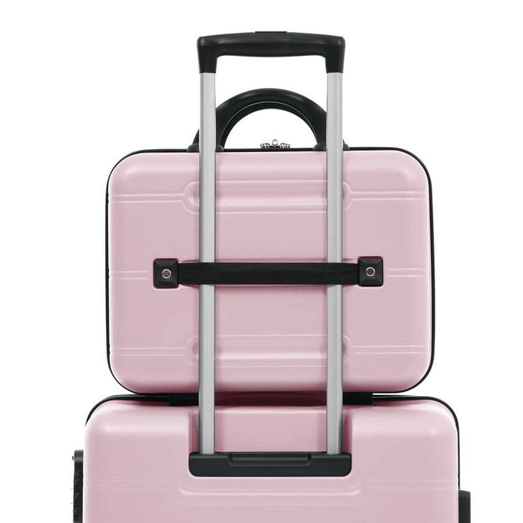 Pink suitcase with a black handle on a white background