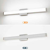 A modern linear wall light fixture shown in two states: illuminated at the top with an orange &