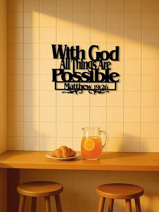 Inspirational wall decor with 'With God All Things Are Possible - Matthew 19:26' quote in a cozy kitchen setting with orange juice and croissant.