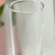 Close-up of the rim and upper portion of a blue acrylic unbreakable champagne flute, highlighting its smooth finish and durability.