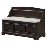 A dark brown wooden storage bench with a light beige upholstered cushion, shown against a plain white background.
