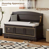 Dark wooden storage bench with cushioned seat in a room setting, highlighting design features.